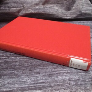 May include: Red hardcover book with the title "Red Soldiers in the Iron Cross Years, 1914-1917" on the spine. The book has a white label on the bottom edge with the number "9418.447".