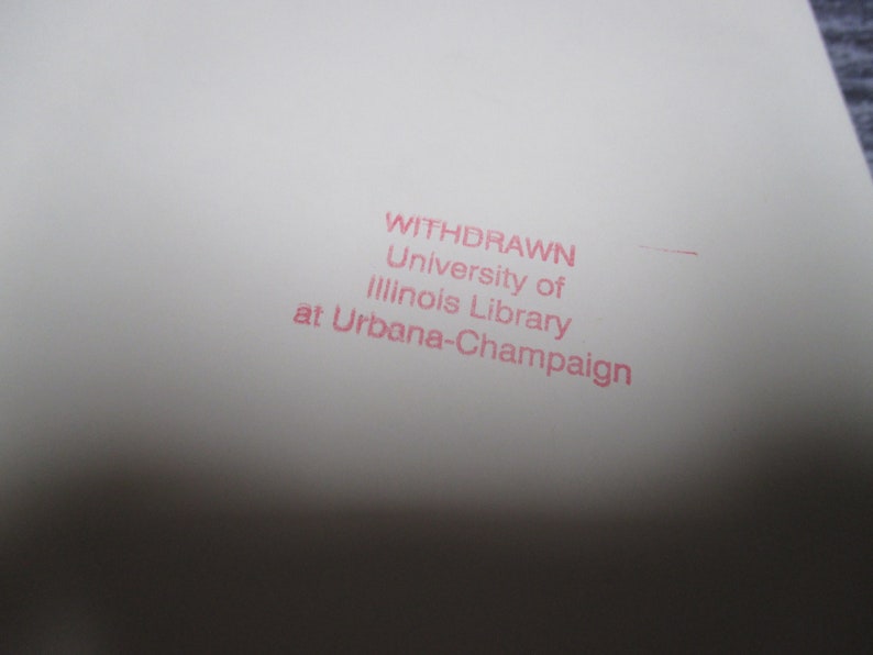 May include: A white paper with a pink stamp that reads "WITHDRAWN University of Illinois Library at Urbana-Champaign".
