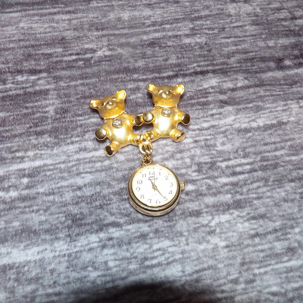 Vintage Faberge like new condition twin bears Quartz dangle watch/brooch new condition, new battery