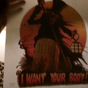 May include: A Halloween-themed poster featuring a silhouetted figure in a top hat and cloak, holding a lantern and staff. The background includes a tombstone with "RIP" and a red moon. The text "I WANT YOUR BODY!" is at the bottom.