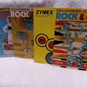 May include: A collection of vintage magazines with titles including "Gem Craft", "Rock & Gem", and "Zymex". The covers feature illustrations of jewelry, Native American designs, and other related topics. The magazines are displayed on a white surface.