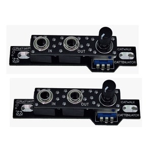 May include: Two black electronic modules with the text "WAVEFORM" and "CATWALK ATTENUATOR" printed on them. Each module has two 1/4 inch input and output jacks, a knob, and a small blue switch.