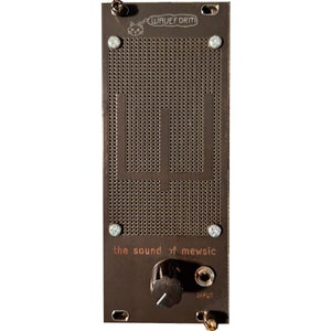 May include: A brown metal box with a black knob and a small jack labeled "INPUT". The box has a grid pattern and the text "the sound of mewsic" and "WAVEFORM" printed on it.