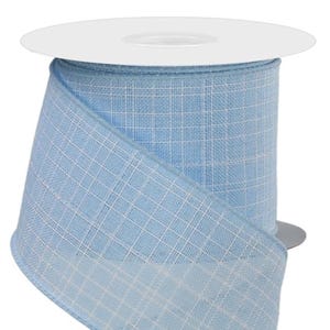 May include: A roll of light blue ribbon with a white grid pattern. The ribbon is made of a textured fabric and is wrapped around a white cardboard spool. The ribbon is ideal for crafts, gift wrapping, and decorations.