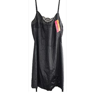 May include: A black slip dress with thin spaghetti straps and a lace neckline. The dress has a flowing, silky appearance and a tag attached to the strap. The garment is designed for sleepwear or lingerie.