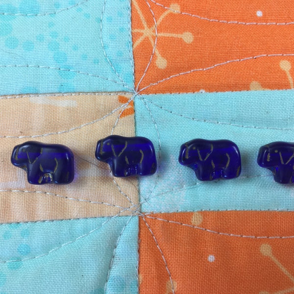 Tiny blue elephant beads. Perfect for embellishments for quilting, children's clothes, bags and dolls