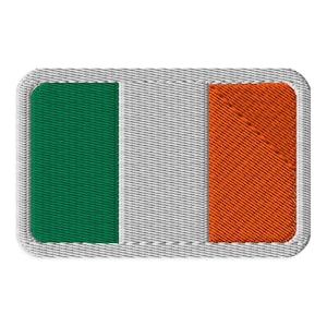 May include: A rectangular embroidered patch featuring the flag of Ireland with vertical stripes of green, white, and orange. The patch has a thick, light gray stitched border with a visible fabric texture throughout the entire design.