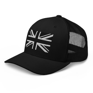 May include: Black trucker cap with a white embroidered Union Jack emblem. The cap has a curved peak and a mesh back for ventilation. A fashionable accessory for everyday wear.