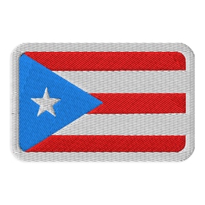 May include: Embroidered patch depicting the flag of Puerto Rico. The design features a blue triangle with a white star, and red and white horizontal stripes. The patch has a grey border.
