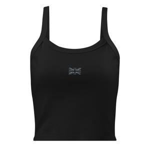 May include: Black crop top with thin straps and a small, embroidered Union Jack flag on the front. The top is made of a ribbed fabric and has a scoop neckline. A simple, casual top for everyday wear.