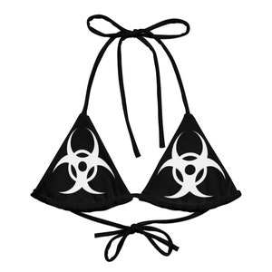 May include: Black bikini top with a white biohazard symbol on each side.