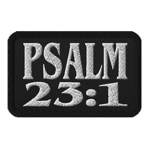 May include: Black embroidered patch with white text that reads "PSALM 23:1".