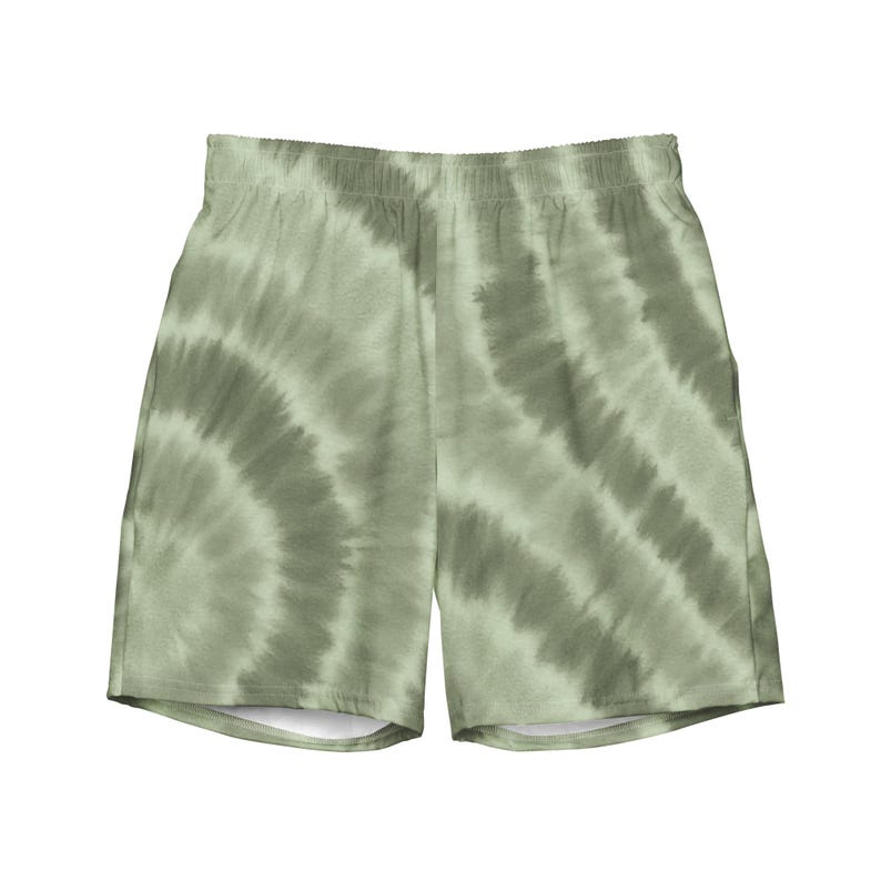 Easy on the eyes, lighter on the planet. These recycled swim trunks feature a soft sage green tie dye pattern—earthy, understated, and effortlessly cool. With quick-dry fabric, mesh lining, and side pockets, they’re built for beach days, lakeside lounging, or wherever the water takes you. 🌿🌊♻️