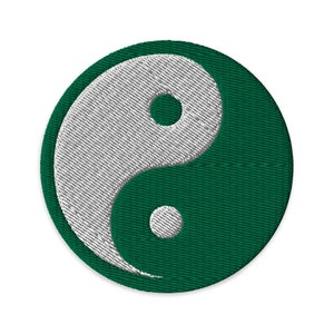 May include: A green and white yin yang symbol embroidered on a circular patch.