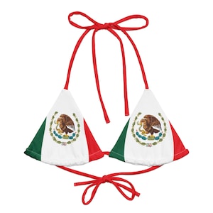 May include: Red, white, and green bikini top with the Mexican flag design. The top features the Mexican coat of arms with an eagle perched on a cactus.