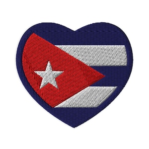 May include: Embroidered patch in the shape of a heart, featuring the Cuban flag. The design includes a red triangle with a white star, white stripes, and a navy blue heart border. Ideal for jackets, bags, or other fabric items.