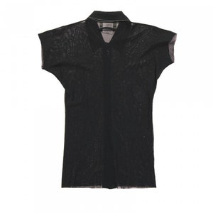 May include: A black sheer collared shirt with short sleeves.