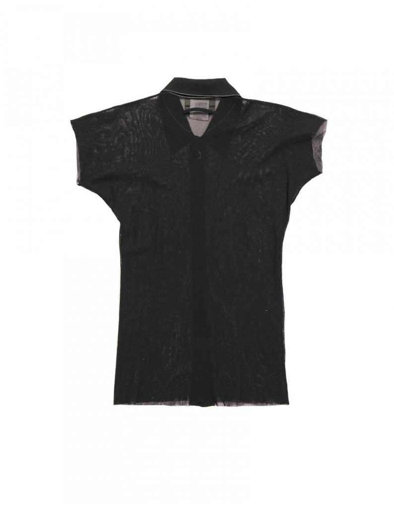 May include: A black sheer collared shirt with short sleeves.