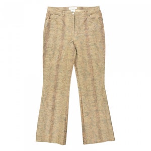 May include: Tan-colored, textured pants with a flared leg. The pants have a high waist, belt loops, and pockets. The fabric has a subtle pattern with vertical lines in shades of tan, brown, and green. The pants are designed for a comfortable fit.