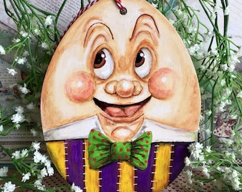 Jolly giant Humpty Dumpty in a pie box from Alice in Wonderland. Hand painted Easter Wooden hanging decoration ornament topper