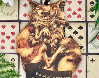 Alice in Wonderland Cheshire Cat pink fantasy hanging decoration. Wonderfully weird vintage style Christmas tree ornament decor.