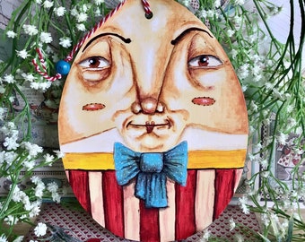 Giant Humpty Dumpty in a pie box from Alice in Wonderland. Easter or Christmas hand painted wooden hanging tree topper decoration ornament