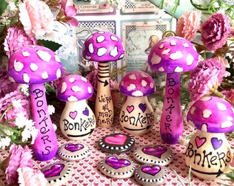 Bonkers hand painted Alice in Wonderland Cheshire Cat wooden mushroom and pebble gift set. Quirky pink Fly Amanita Agaric Toadstool mushroom