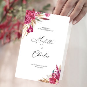 May include: Wedding program with a floral design featuring burgundy flowers, gold wheat, and greenery. The text reads "Welcome to the wedding of Michelle & Charles, Sofitel Events Center, CA, 15 June 20XX".