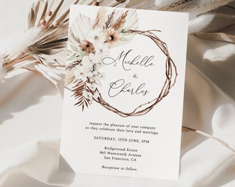May include: A wedding invitation with a watercolor illustration of a wreath made of dried branches and pampas grass. The names "Michelle & Charles" are written in cursive script. The invitation details the date, time, and location of the wedding.