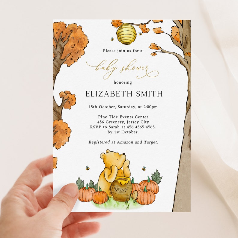 May include: A baby shower invitation featuring a watercolor illustration of Winnie the Pooh with pumpkins, a honey pot, and a beehive. The invitation includes the text "baby shower" and details for Elizabeth Smith's shower.