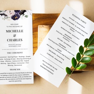 Peut inclure: Deux programmes de mariage sur une surface en bois. Le programme de gauche présente un motif floral avec les noms Michelle & Charles et la date du 15 novembre 2022. Le programme de droite liste le cortège nuptial.