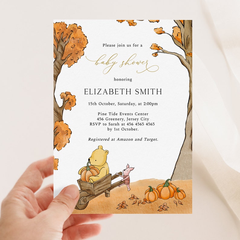 May include: Baby shower invitation featuring Winnie the Pooh pushing a pumpkin-filled wheelbarrow with Piglet. The invitation includes the text "Please join us for a baby shower honoring ELIZABETH SMITH" and event details.
