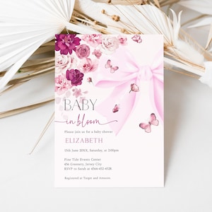 May include: A baby shower invitation with a floral and butterfly design. The invitation features the text "BABY in bloom" and includes details such as the date, time, and location. The design incorporates pink and purple flowers, a pink bow, and butterflies.