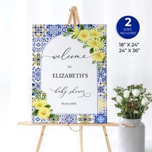 May include: Welcome sign for a baby shower with a blue and yellow tile pattern border and yellow flowers. The sign says "Welcome to Elizabeth's Baby Shower 5th June 20XX".