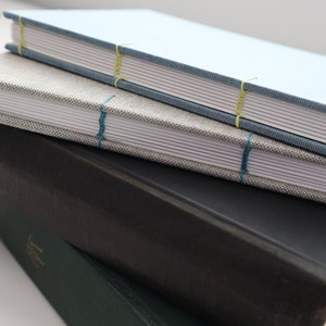 two examples of coptic bindings you can make using the coptic bookbinding materials kit