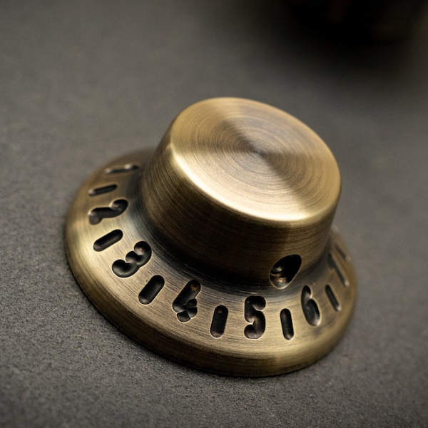 Guitarra Gibson Tophat de latón vintage, amplificador, perilla de pedal