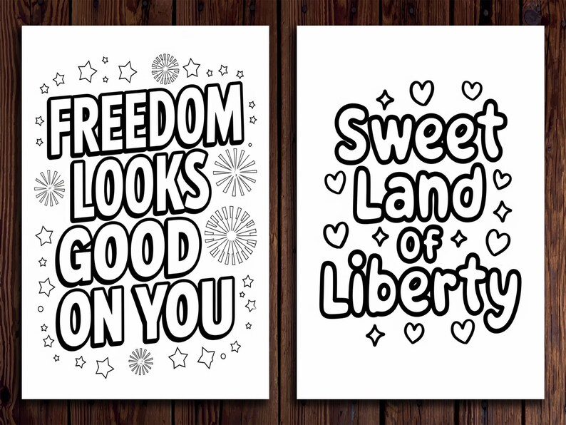 May include: Two black and white prints with patriotic themes. One says "Freedom Looks Good On You" with star and firework designs. The other says "Sweet Land of Liberty" with hearts and diamond shapes.
