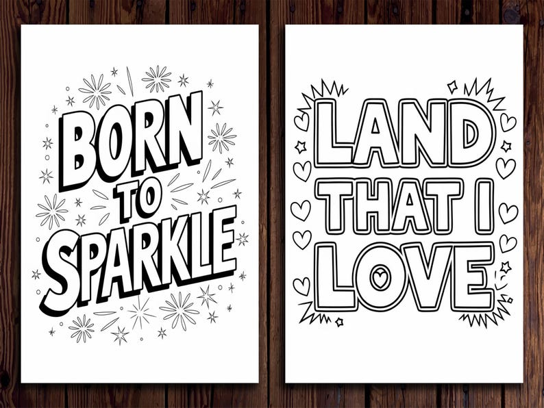 May include: Two black and white art prints with inspirational quotes. The first print says "BORN TO SPARKLE" with starburst and star illustrations. The second print says "LAND THAT I LOVE" with heart and star illustrations.