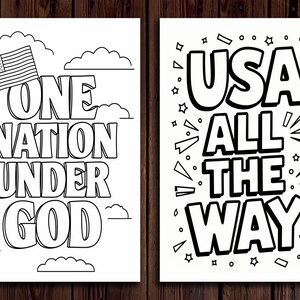 May include: Two black and white prints with patriotic themes. One features the text "ONE NATION UNDER GOD" with an American flag and clouds. The other says "USA ALL THE WAY" with stars and bursts.