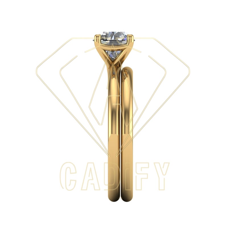 May include: A pair of gold wedding bands with a large, clear, square-shaped diamond set in the center of the top band.