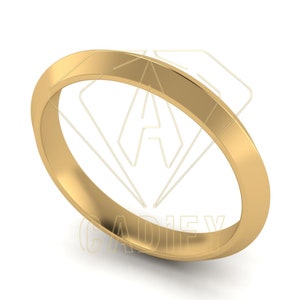 Może przedstawiać: Prosta złota obrączka ślubna o gładkim, polerowanym wykończeniu.