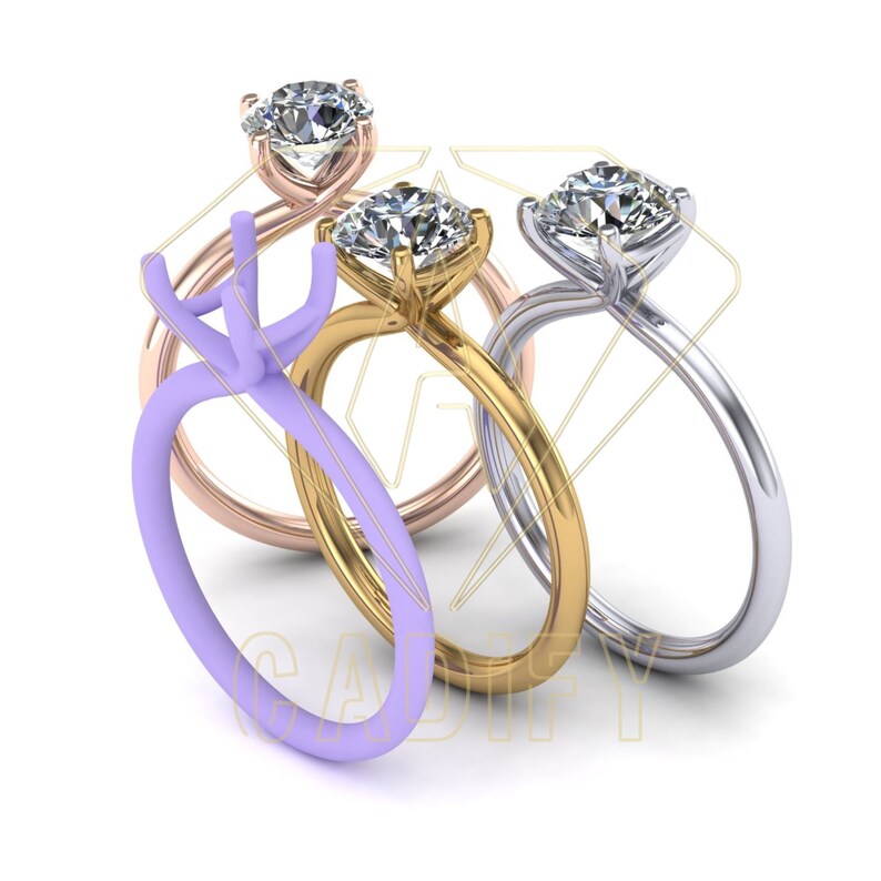 May include: Three engagement rings with different metal settings. The rings are stacked on top of each other. The top ring is silver, the middle ring is gold, and the bottom ring is rose gold.