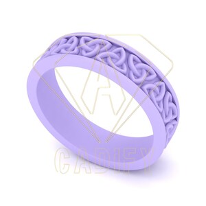 May include: A light purple ring with a Celtic knot design. The ring has a smooth, rounded band and a raised pattern of interwoven knots around the top. The ring is a solid color and appears to be made of a single material.