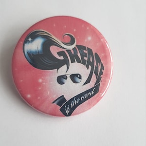 A 38mm Grease badge
