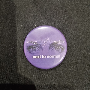 A 38mm Next to Normal badge