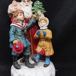 Vintage Enesco The Santa Claus Shoppe Christmas Musical St Nicholas circa 1890 Made in 1986.