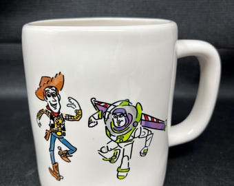 Rae Dunn Disney Pixar Toy Story Coffee Mug W/WOODY & BUZZLIGHTYEAR NEW. S2