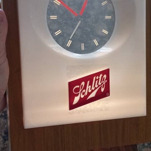 Horloge vintage Schlitz Beer lumineuse avec aiguilles flottantes