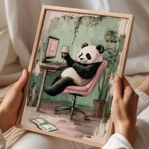 May include: A black and white panda bear sitting in a pink chair with a glass of red wine in its hand. The panda is wearing a relaxed expression and is looking at the viewer. The chair is in front of a desk with a computer and a keyboard. The background is a green wall with plants.