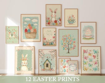 May include: A collection of 12 framed Easter prints. The prints feature pastel colors and spring-themed illustrations, including bunnies, eggs, butterflies, and floral designs. The prints are displayed on a white wall.